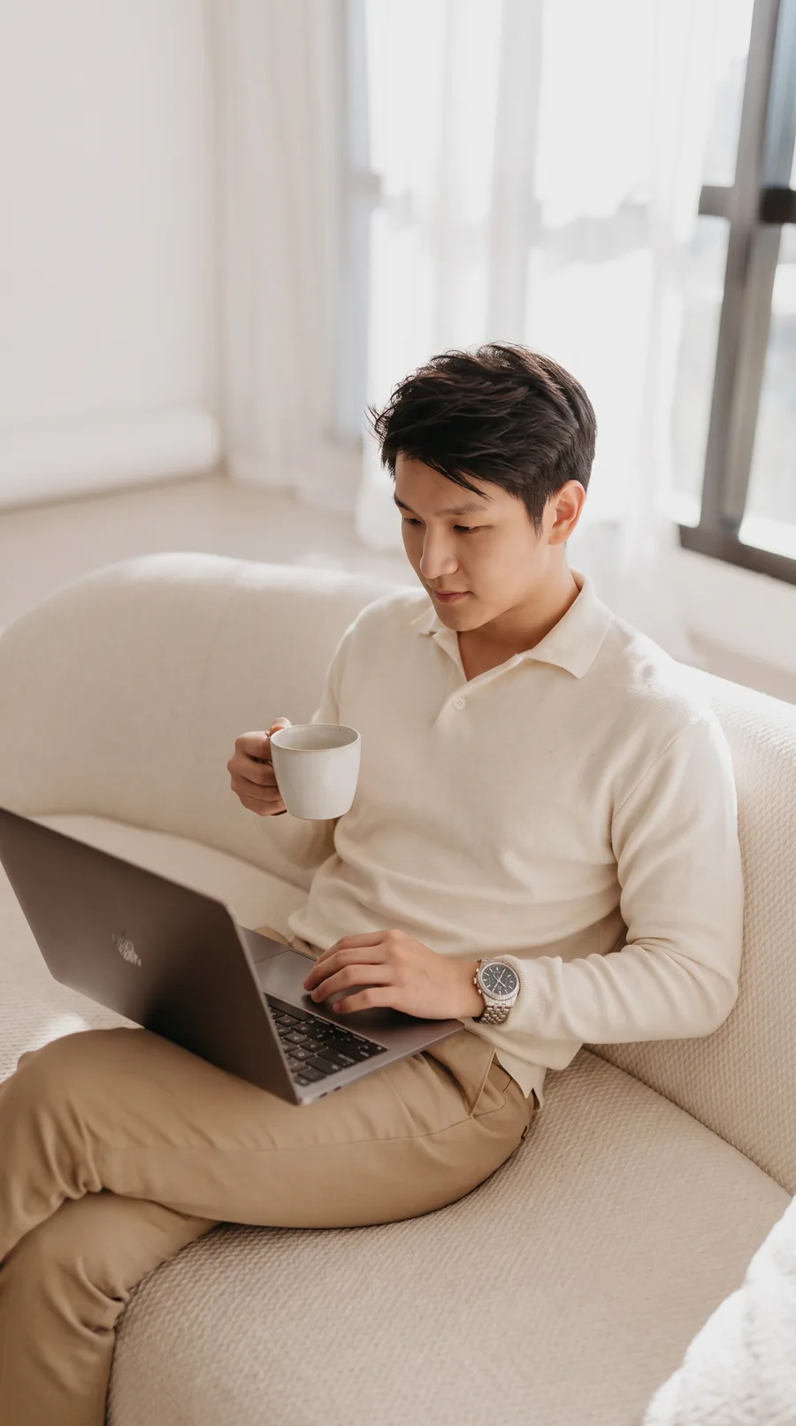 Jamus Lee comparing Singapore market regions on a laptop