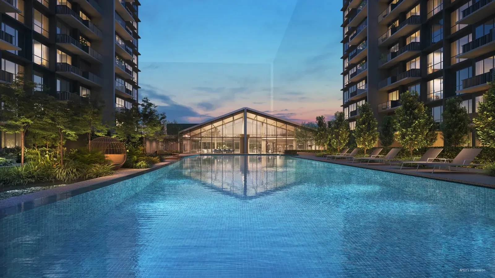 Lucerne Grand 37-metre lap pool at dusk with the glass clubhouse pavilion between two residential towers