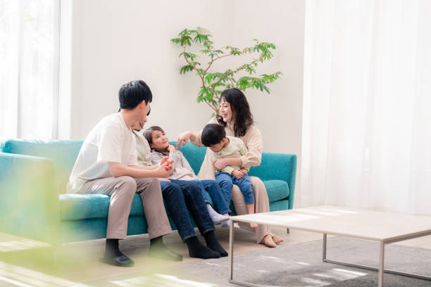 Happy Asian family enjoying their new home in Singapore
