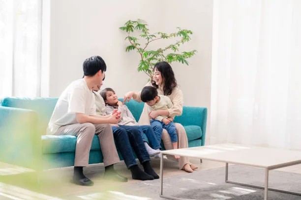 Happy Asian family enjoying their new home in Singapore
